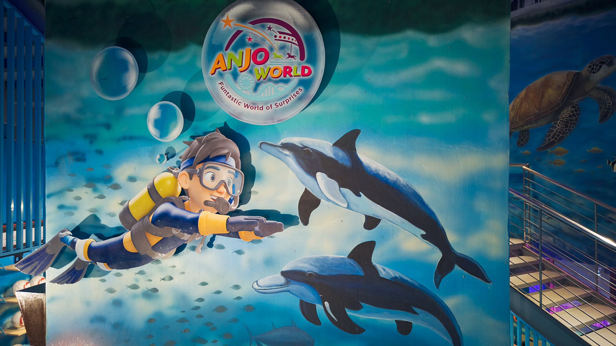 Anjo World mural with diver and dolphins